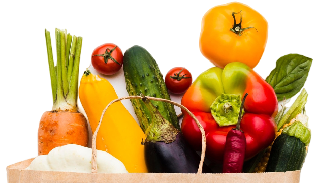 Paper grocery bag overflowing with fresh vegetables